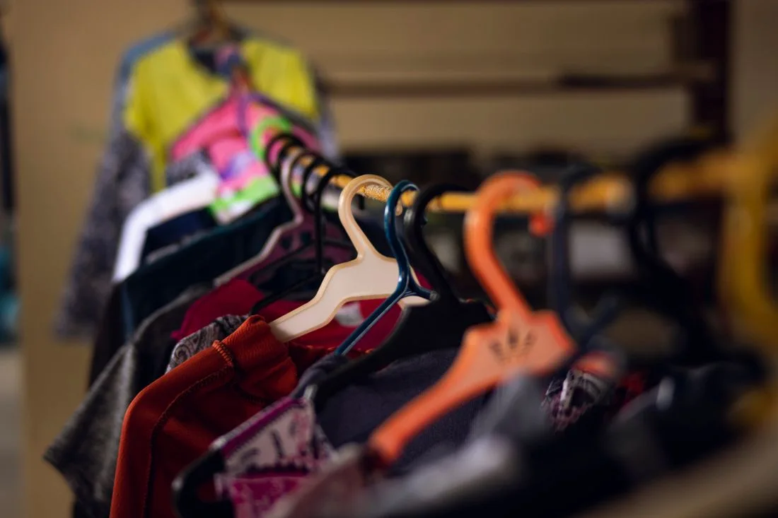 Colorful garments hanging on a clothing rack