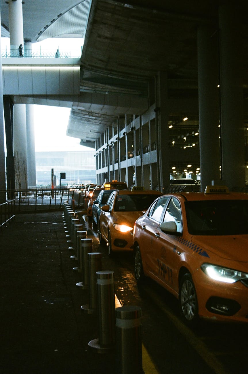 line of yellow cabs at the airport