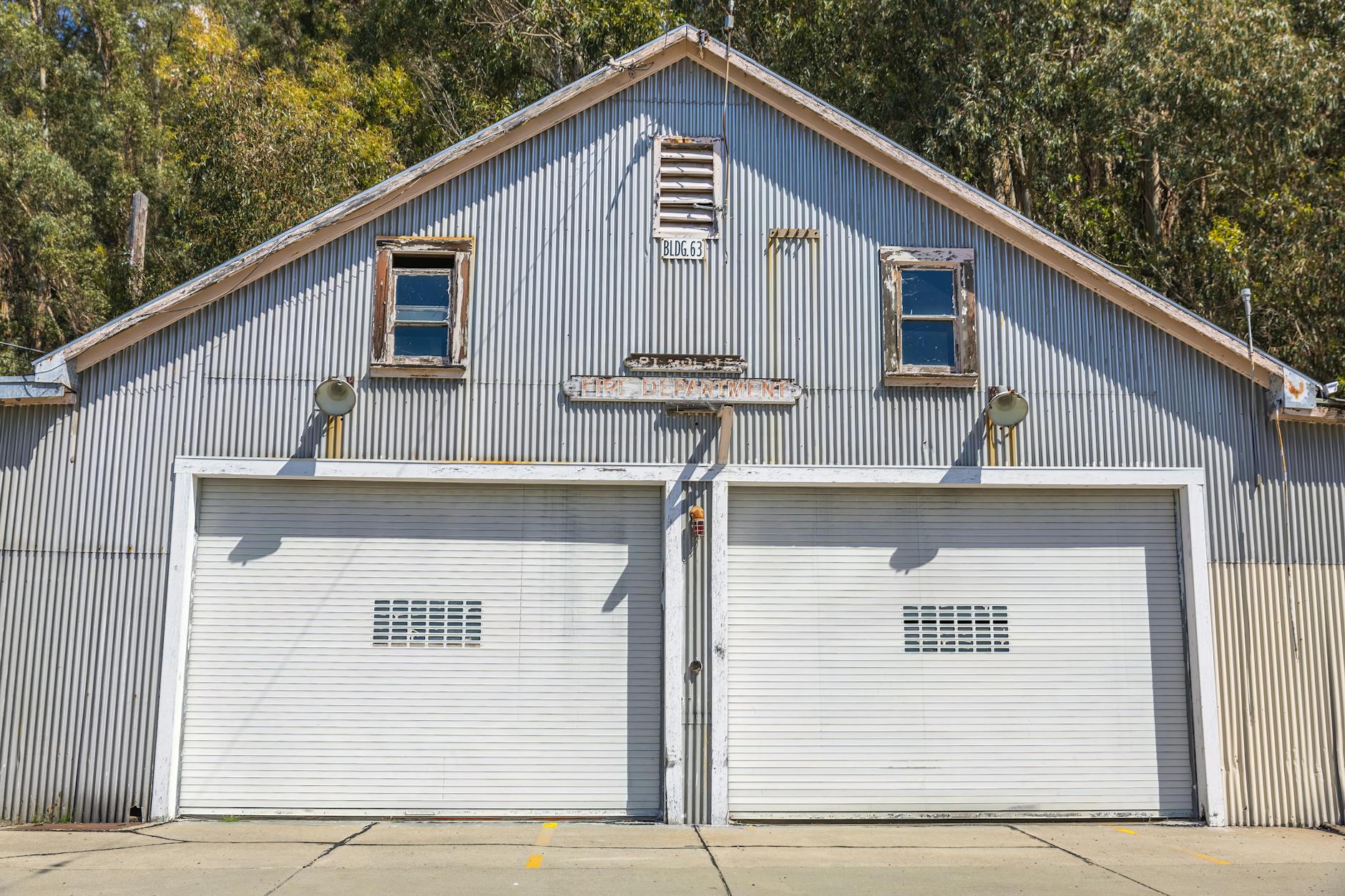 sunlit building with garage doors