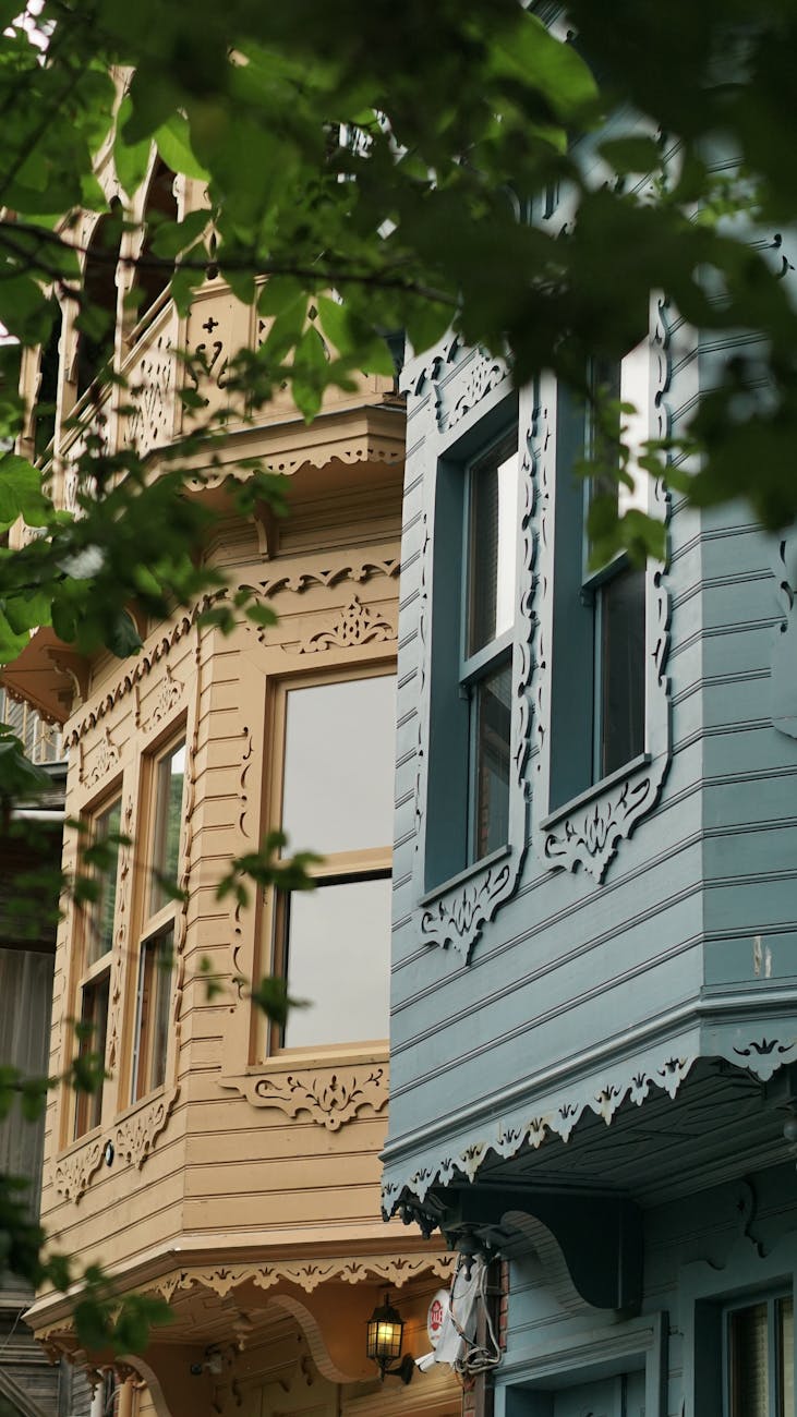 a row of colorful houses with windows and balconies