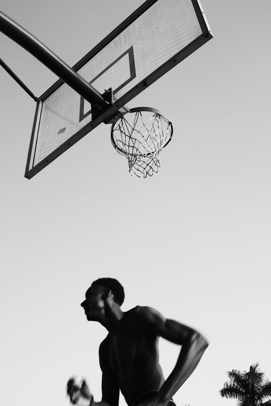 dynamic black and white outdoor basketball scene