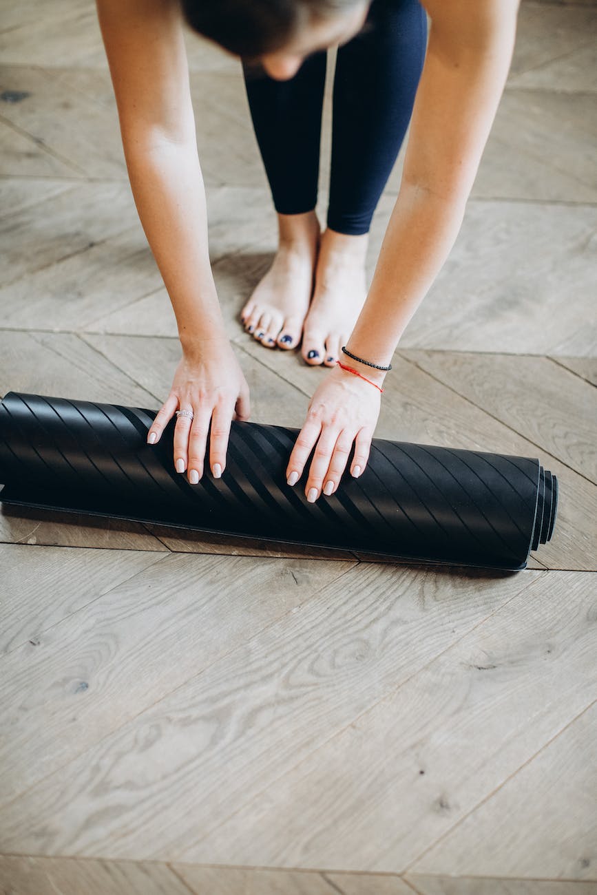 woman preparing her yoga mat