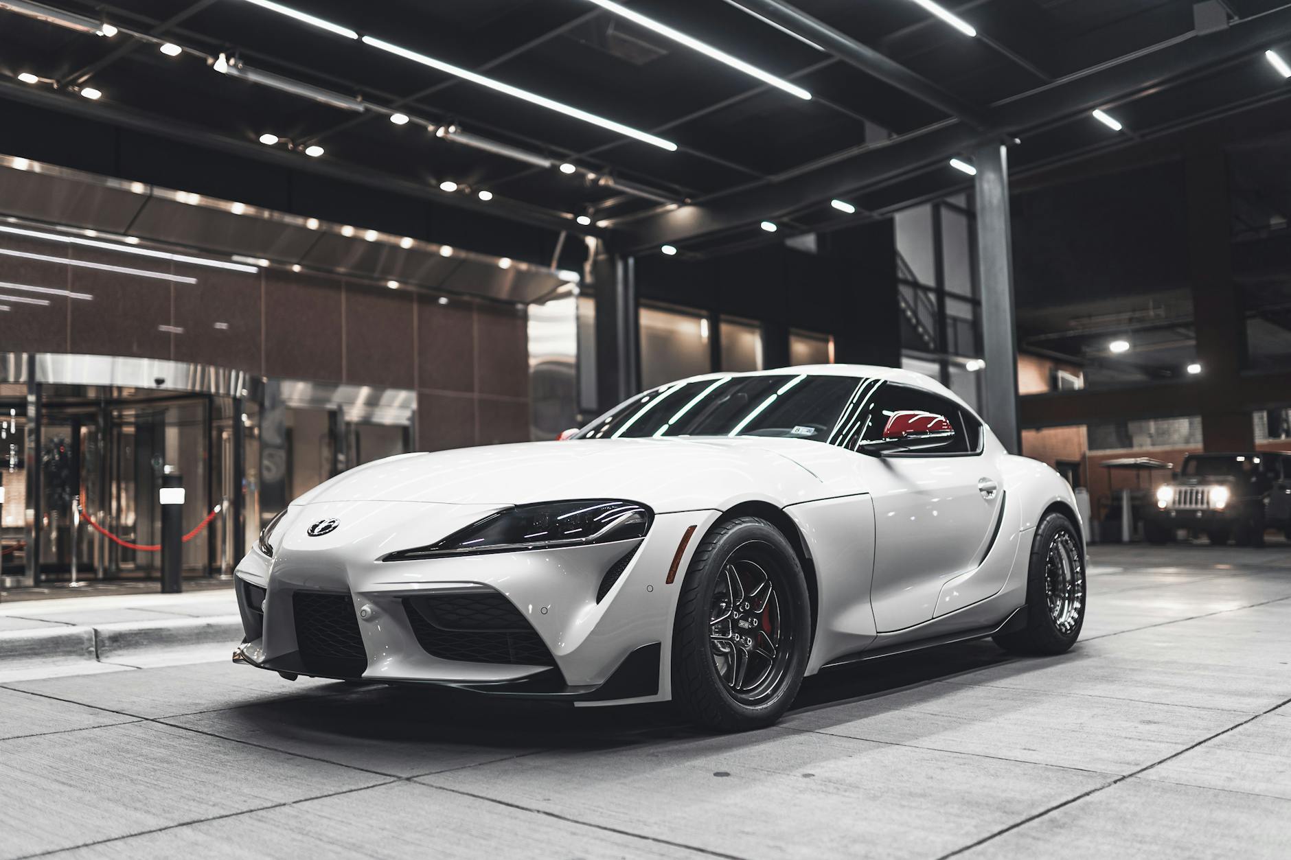 photo of supra parked in front of building