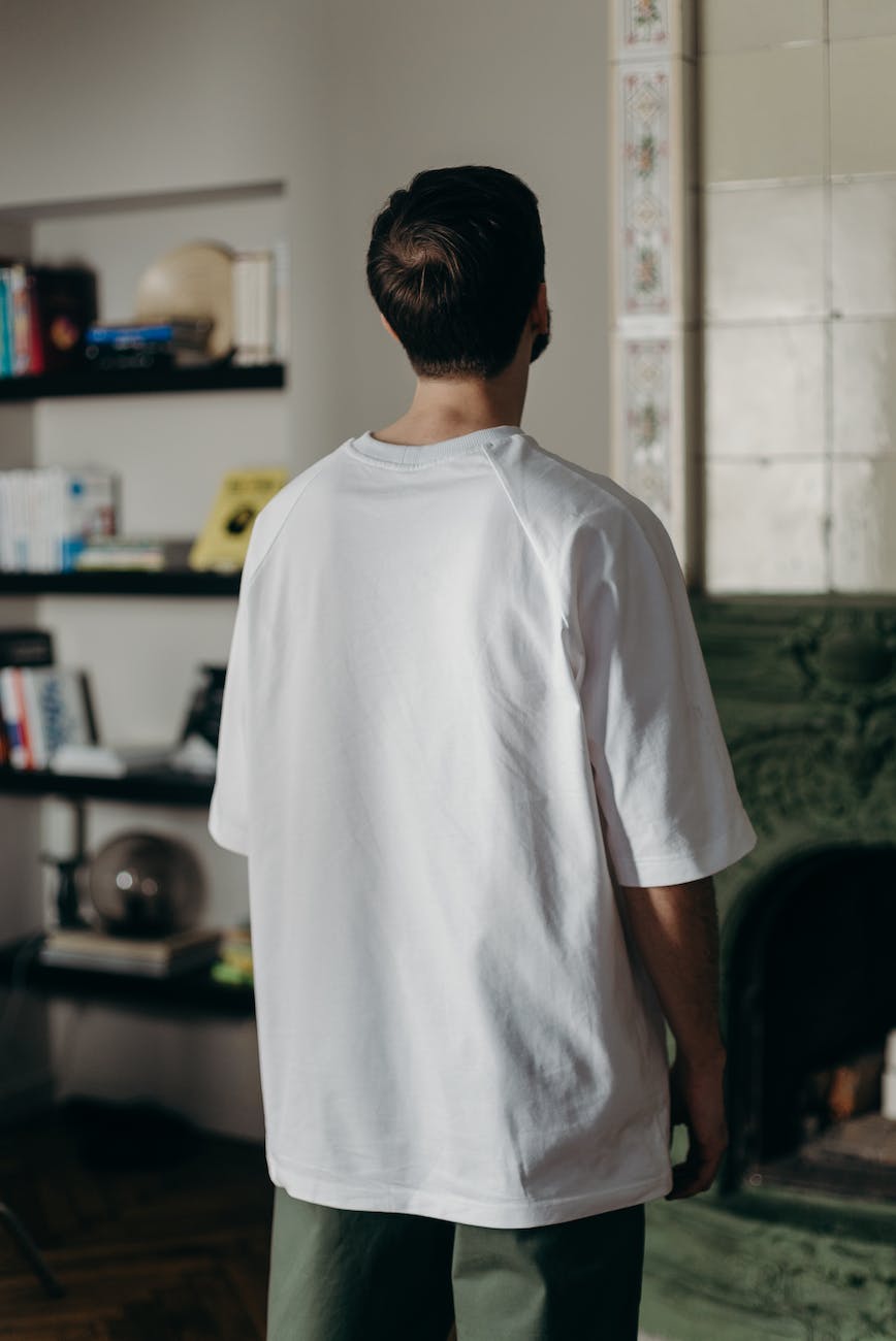 man in white crew neck t shirt standing