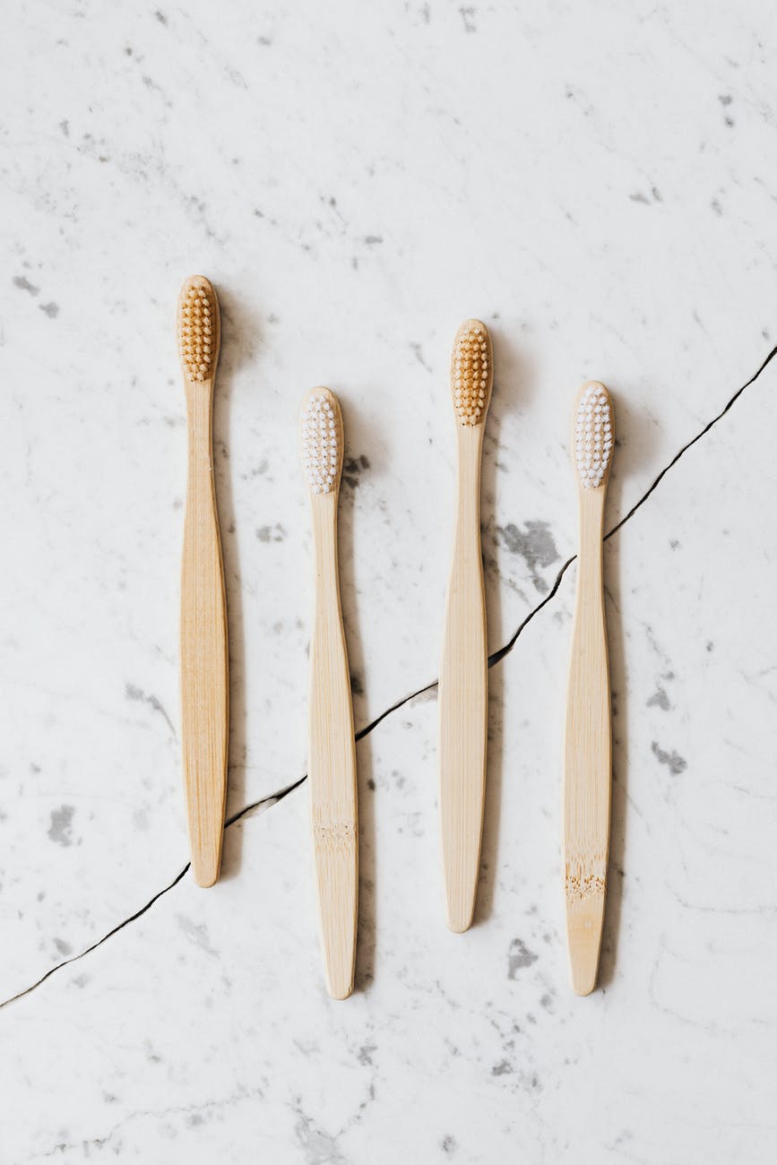 brown wooden toothbrush on white background