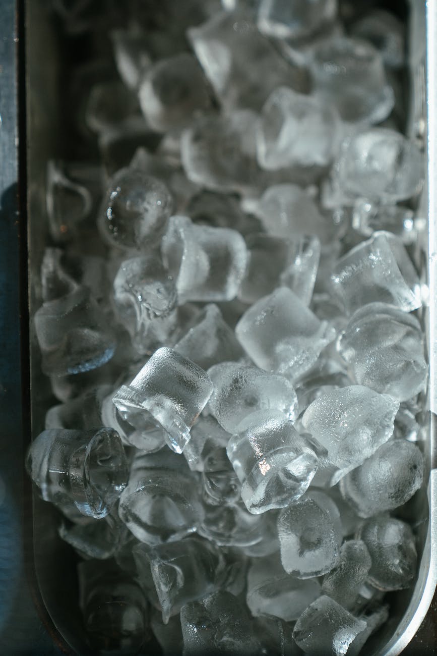 clear glass container on black surface