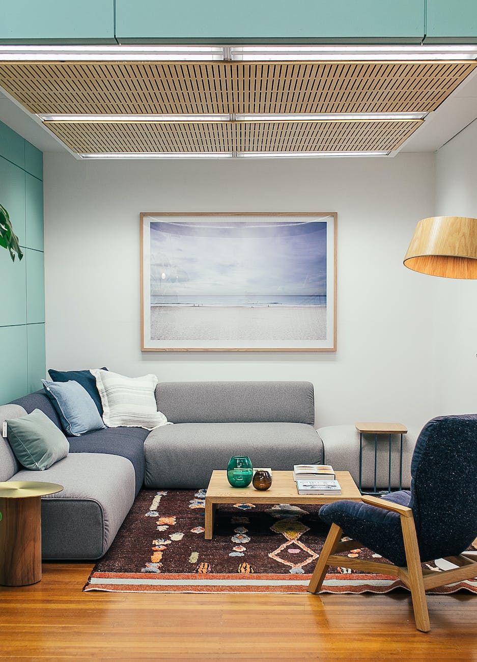 cozy living room interior with comfy couch and armchair and wooden details