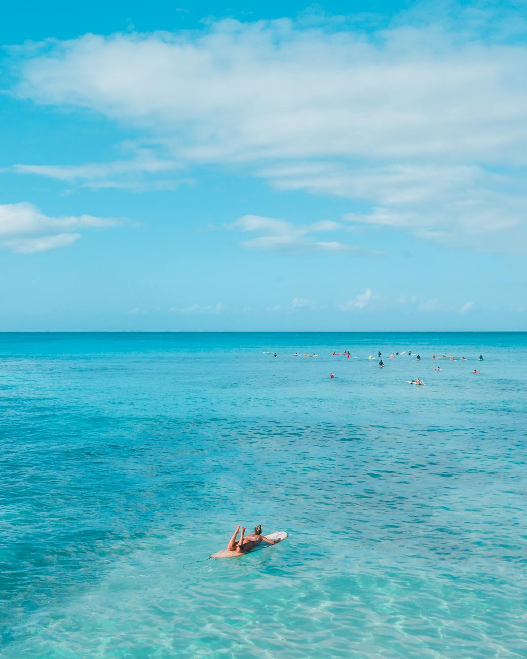 tourists relaxing in sea on paddleboard