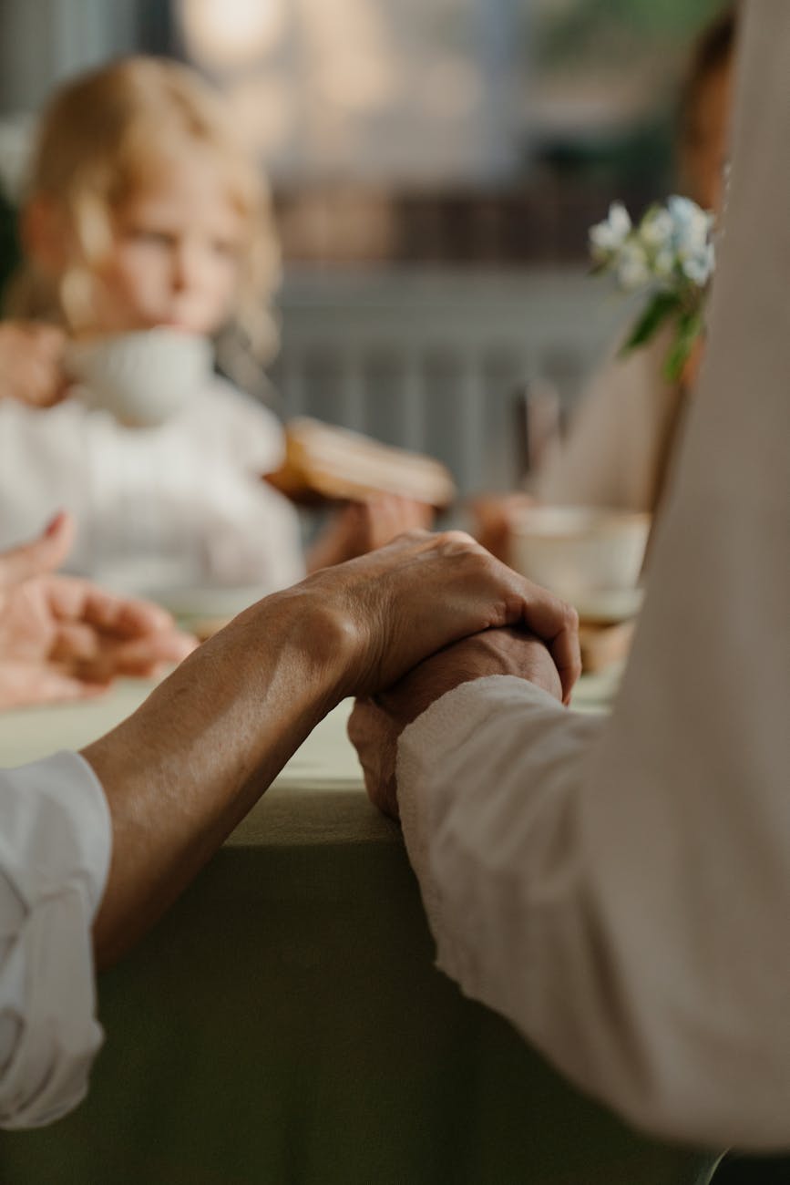 holding hands of man and woman in close up shot