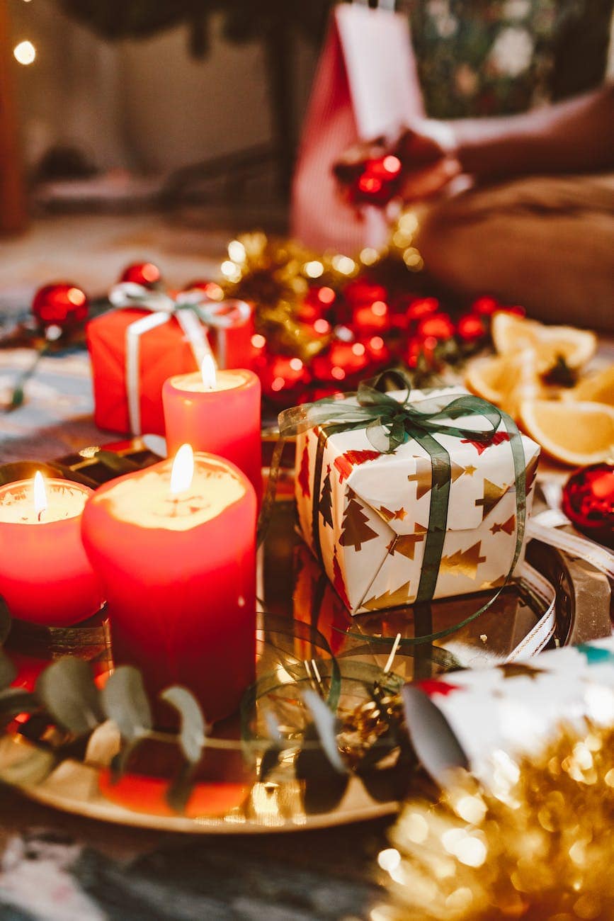 lighted candles besides a gift