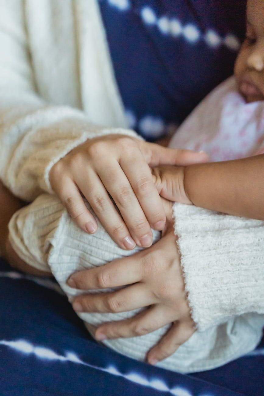 crop mother with black baby