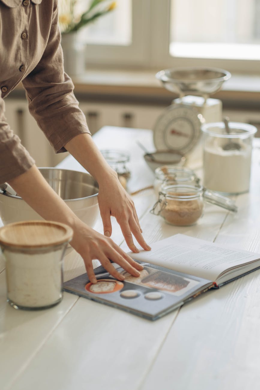 woman reading a cookbook