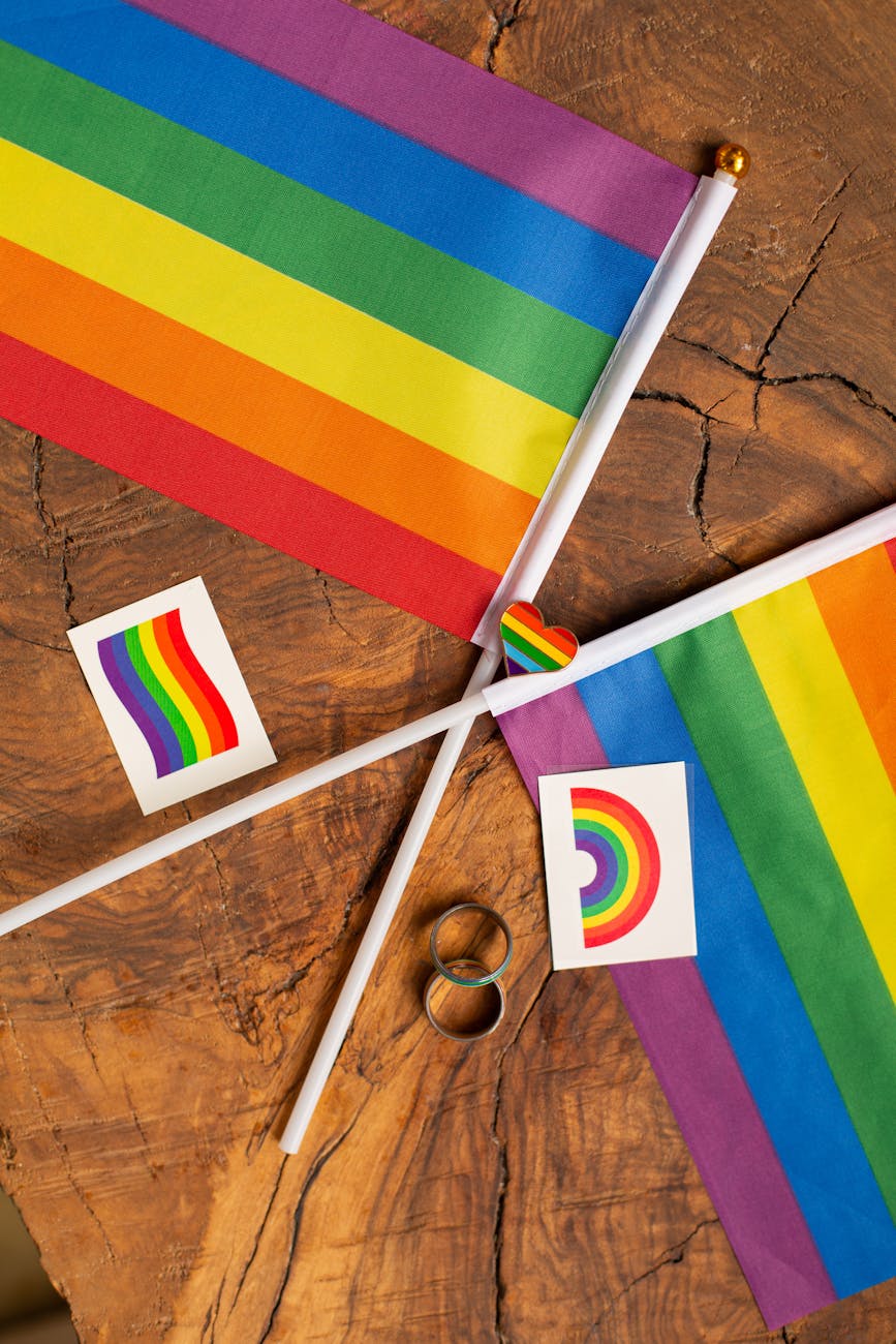 rainbow flags on wooden surface