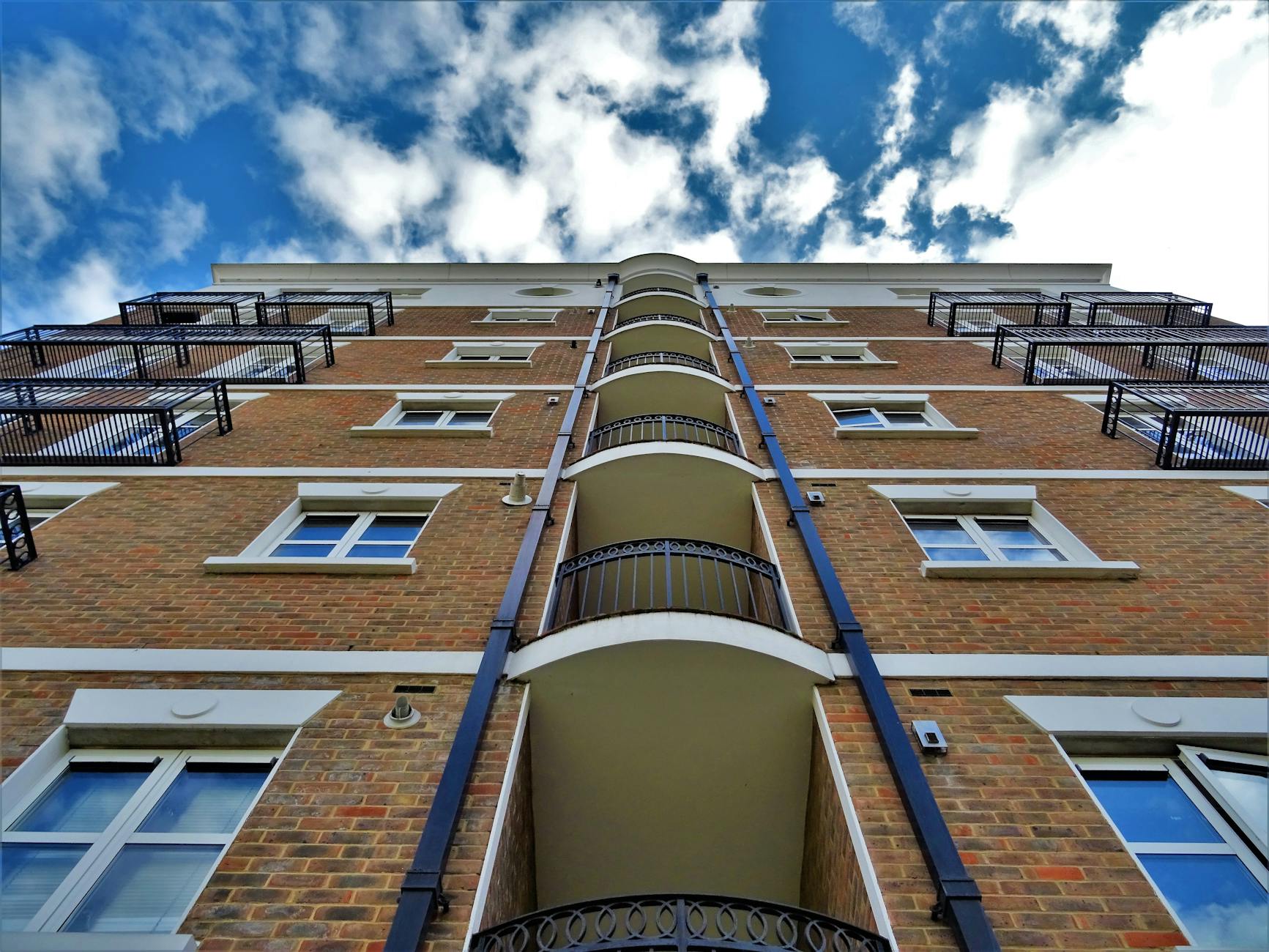 low angle photography of brown brick building